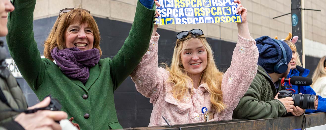 RSPCA supporters cheering on runners